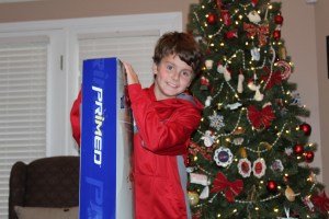 Alec with one of the soccer goals. It was a soccer themed Christmas