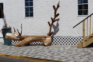 Very cool dinosaur log bench 