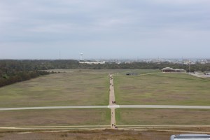 The monument is on a Hill overlooking the first runway