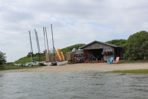 A vendor rents sailboats, kayaks etc right in the park