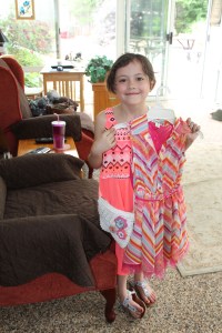 My niece Elise with the dress and purse I bought her for her birthday