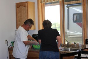 Lee showing Linda how he makes Caesar salad from scratch