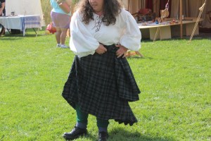 Roll excess cloth at waist over belt