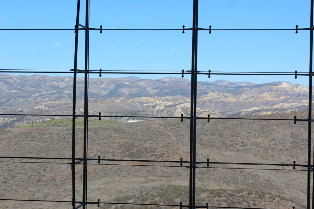 One wall was all glass three stories tall with an amazing view