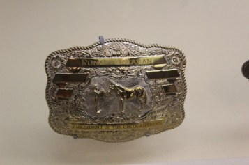 Many dignitaries gave him custom belt buckles