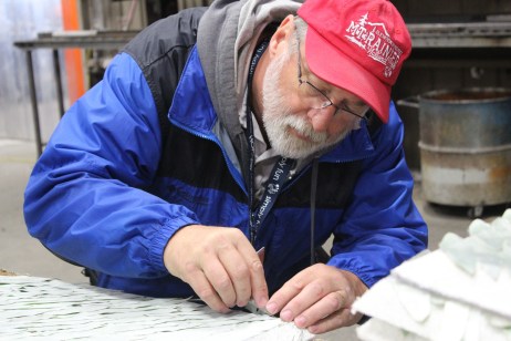 Others were gluing silver leaf onto panels