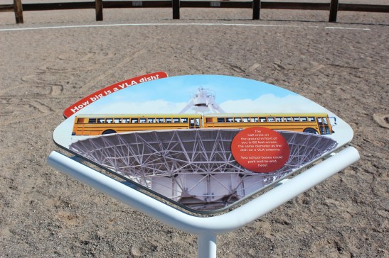 This sign shows how big the dishes are. Two school buses could fit across their width