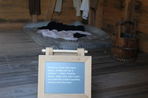 Versus the bed and clothes of one of the field slaves who raised numerous children in this one room