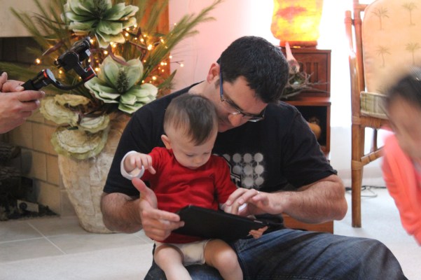 Lex with Eddie showing us how he can play Ipad games. IT's really amazing for an 18 month old