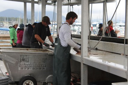 Cute guys cleaning fish