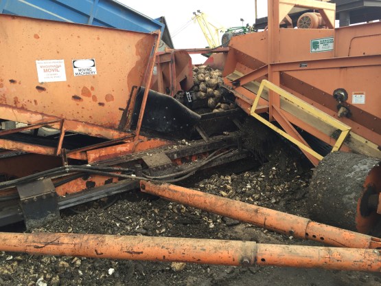 Side of hopper with missing panel. This detritus was was about knee deep on me