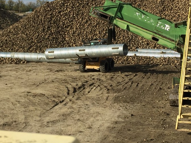 The pipes are carried by a bobcat and placed very carefully