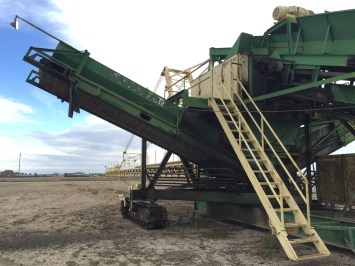 Where the dirt comes out and goes into the empty truck
