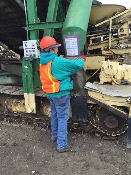 MArie is putting the sack around the funnel