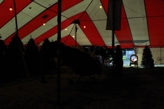 Moving to the front center of the tent