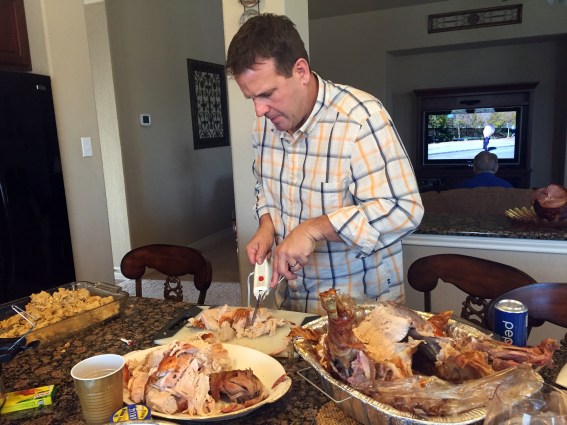 Greg is very serious about cutting the turkey