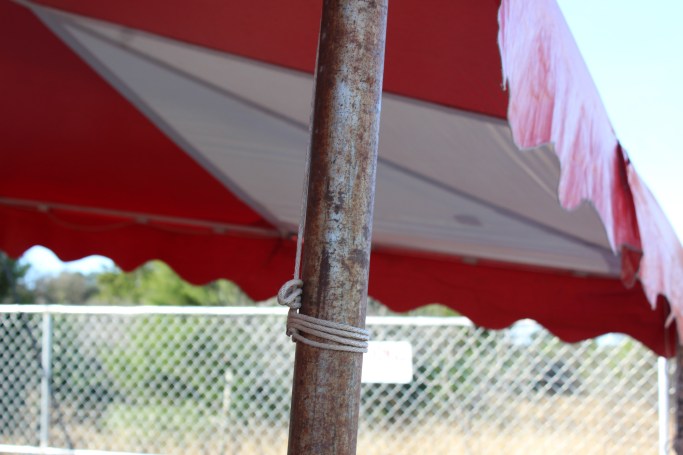 Then the unwrapped the ropes on the side poles