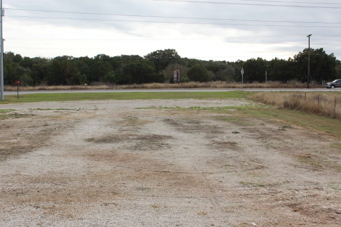 We only stayed one night on this empty lot and felt less exposed because the lights from the gas station next door kept it well lit, but I wouldn't want to stay for long periods. The tent not only gave us an illusion of privacy it also helped quite a bit as a wind break