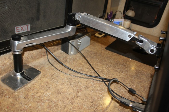 The monitor slides on this bar in the back and can be adjusted